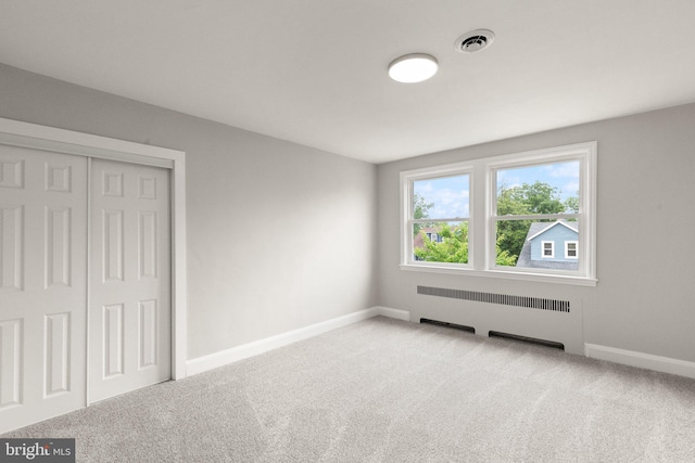2811 Westfield Ave, Baltimore, MD 21214 - unfurnished bedroom with radiator heating unit, carpet flooring, and a closet