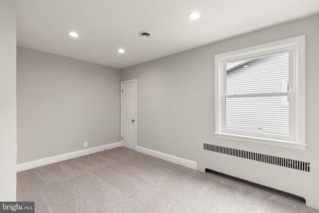 2811 Westfield Ave, Baltimore, MD 21214 - empty room featuring radiator, carpet flooring, and recessed lighting