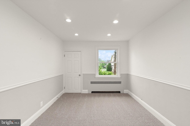 2811 Westfield Ave, Baltimore, MD 21214 - carpeted spare room featuring radiator and recessed lighting