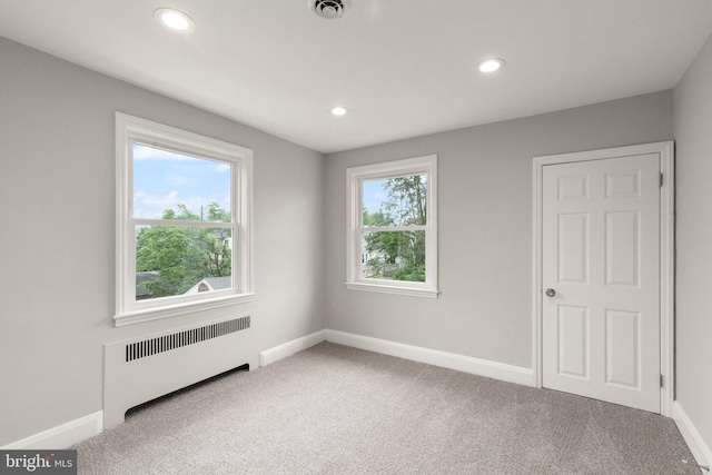 2811 Westfield Ave, Baltimore, MD 21214 - unfurnished bedroom with radiator, carpet, and recessed lighting