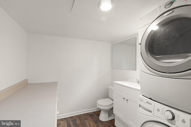 2811 Westfield Ave, Baltimore, MD 21214 - bathroom featuring stacked washer and clothes dryer, wood finished floors, and vanity