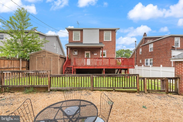 2811 Westfield Ave, Baltimore, MD 21214 - back of property with a shed, brick siding, a fenced backyard, and a wooden deck