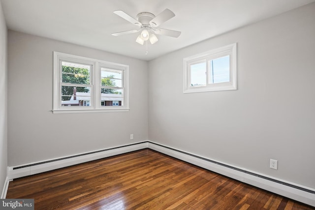 unfurnished room with healthy amount of natural light, a baseboard heating unit, wood finished floors, and ceiling fan
