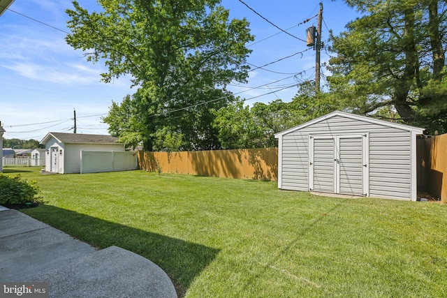 view of yard featuring a shed and an outdoor structure