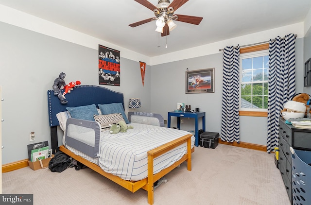 bedroom featuring carpet flooring, baseboards, and ceiling fan