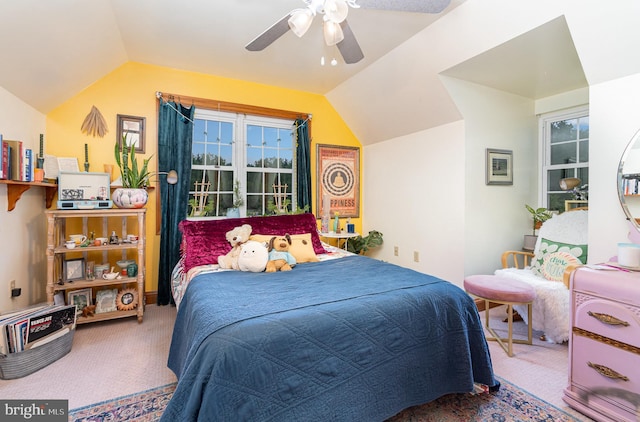 bedroom featuring carpet, vaulted ceiling, and ceiling fan