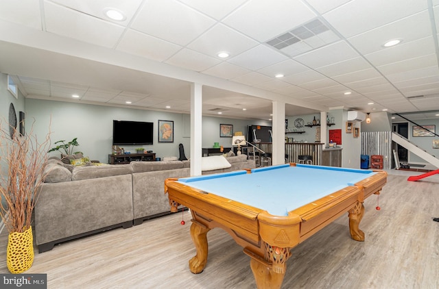 playroom featuring light wood-style floors, pool table, bar, recessed lighting, and a paneled ceiling