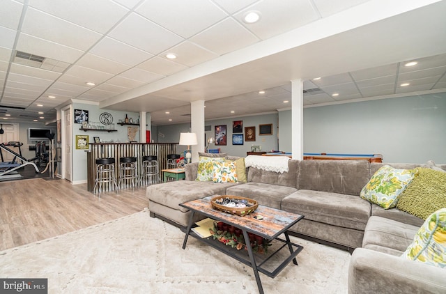living area featuring a bar, wood finished floors, a paneled ceiling, recessed lighting, and billiards