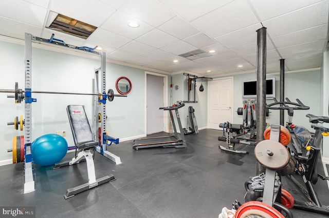 workout area featuring recessed lighting and baseboards