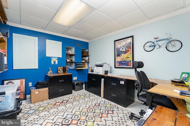 office space with crown molding and a drop ceiling