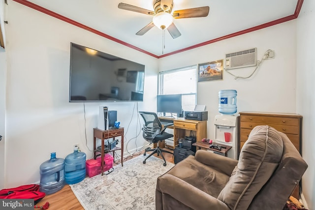 office area with an AC wall unit, wood finished floors, a ceiling fan, and ornamental molding