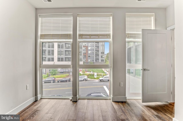 1761 Old Meadow Rd Unit 209, Mclean, VA 22102 - doorway to outside with wood finished floors and baseboards