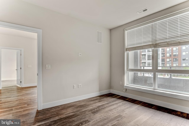 1761 Old Meadow Rd Unit 209, Mclean, VA 22102 - unfurnished room with wood finished floors and baseboards