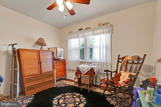 bedroom with a baseboard heating unit and ceiling fan