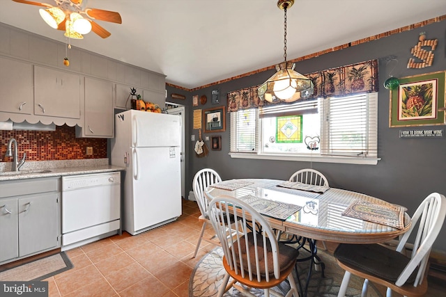 dining room featuring a ceiling fan and light tile patterned floors