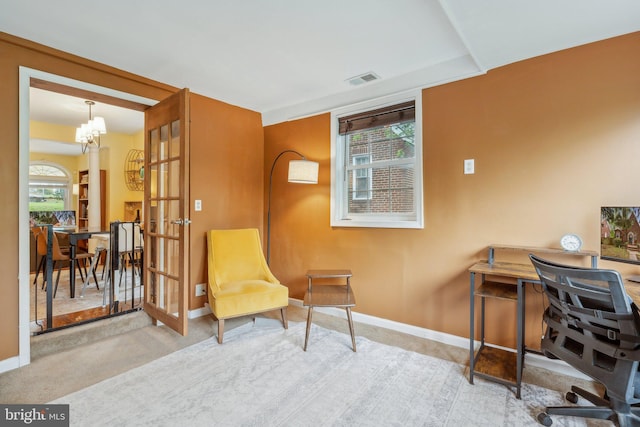 5207 Eugene Ave, Baltimore, MD 21206 - living area featuring baseboards, carpet floors, a chandelier, and an office area