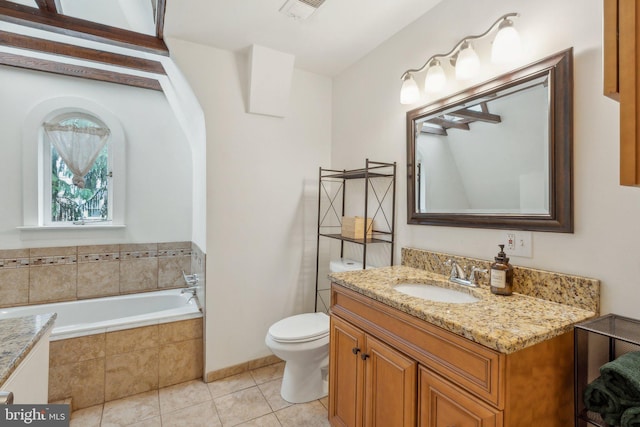 5207 Eugene Ave, Baltimore, MD 21206 - bathroom with vanity, a garden tub, tile patterned flooring, and toilet