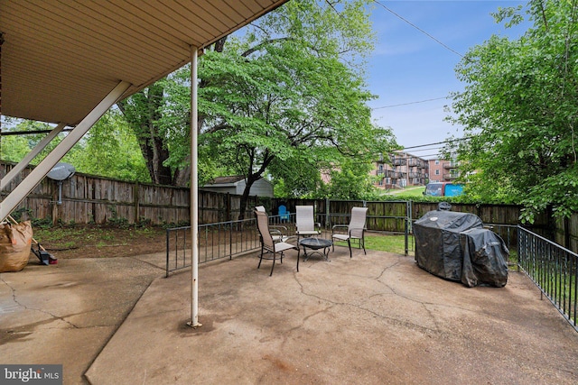 5207 Eugene Ave, Baltimore, MD 21206 - view of patio featuring a fenced backyard and an outdoor fire pit
