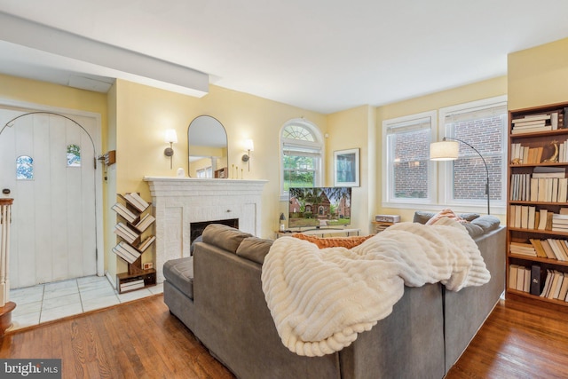 5207 Eugene Ave, Baltimore, MD 21206 - living area featuring wood finished floors and a fireplace