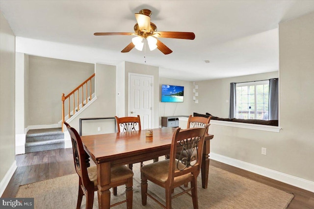 236 Nicole Way, Reading, PA 19608 - dining area with wood finished floors, baseboards, stairway, and a ceiling fan