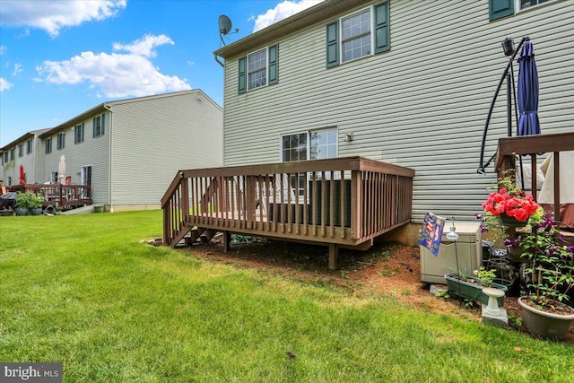236 Nicole Way, Reading, PA 19608 - rear view of property featuring a deck and a lawn