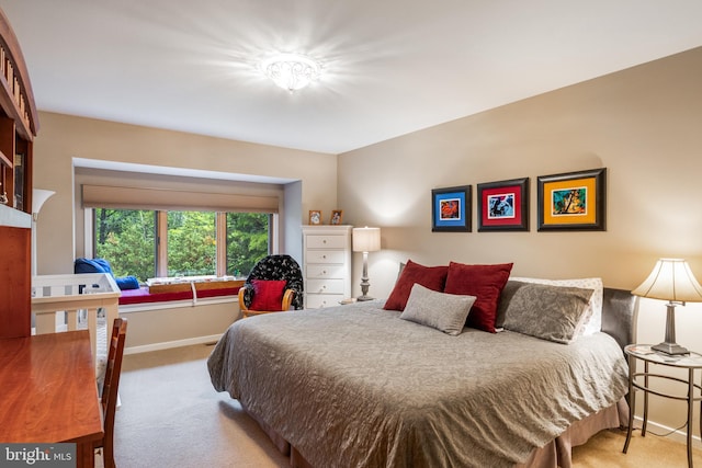 carpeted bedroom with baseboards