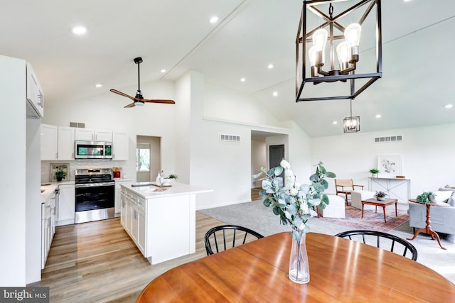 1017 Mill Rd, Leesport, PA 19533 - dining space with light wood-type flooring, recessed lighting, a chandelier, ceiling fan, and high vaulted ceiling