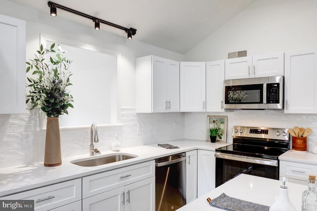 1017 Mill Rd, Leesport, PA 19533 - kitchen featuring appliances with stainless steel finishes, a sink, white cabinets, light countertops, and backsplash