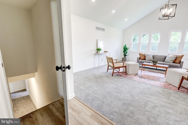 1017 Mill Rd, Leesport, PA 19533 - carpeted living area featuring a chandelier, high vaulted ceiling, recessed lighting, baseboards, and wood finished floors