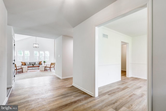 1017 Mill Rd, Leesport, PA 19533 - empty room with light wood-type flooring, vaulted ceiling, a chandelier, and baseboards