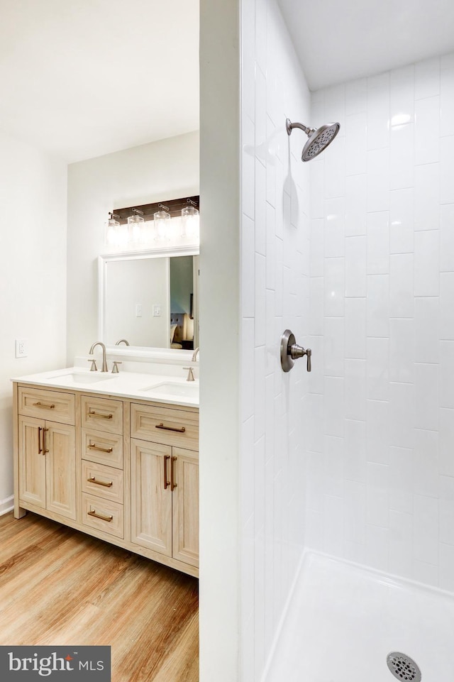 1017 Mill Rd, Leesport, PA 19533 - full bath featuring wood finished floors, a tile shower, and double vanity