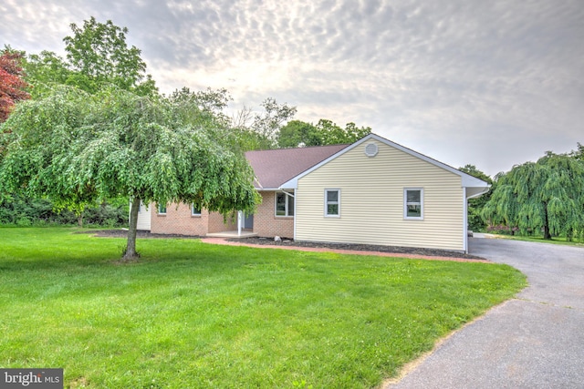 1017 Mill Rd, Leesport, PA 19533 - view of front of house with asphalt driveway, a front lawn, and brick siding