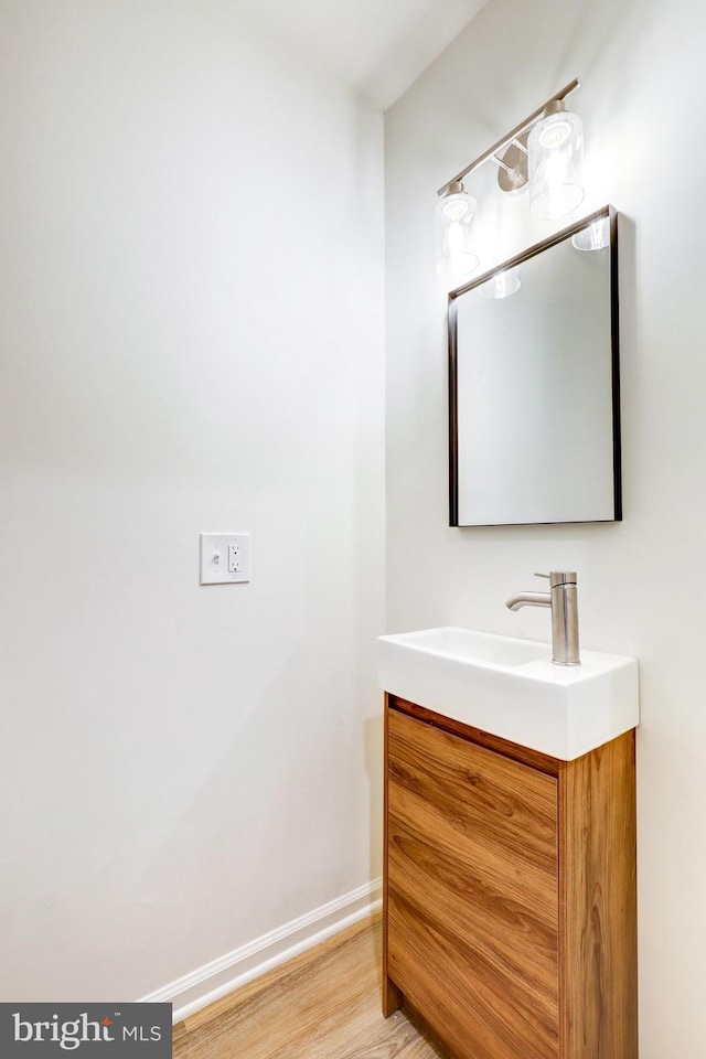 1017 Mill Rd, Leesport, PA 19533 - bathroom featuring vanity, baseboards, and wood finished floors