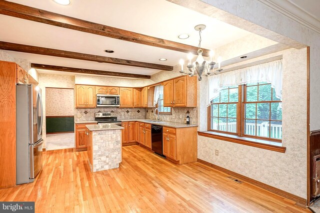 612 Howard Ave, Pitman, NJ 08071 - kitchen with appliances with stainless steel finishes, a sink, light wood-style flooring, a chandelier, and a kitchen island