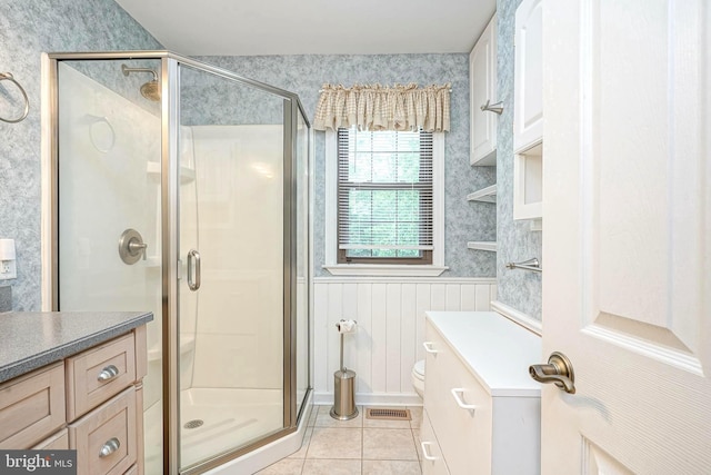 612 Howard Ave, Pitman, NJ 08071 - full bath with wallpapered walls, a shower stall, vanity, tile patterned floors, and a wainscoted wall