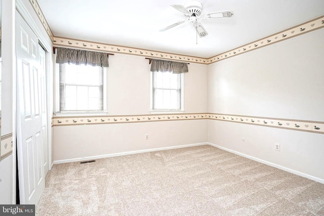 612 Howard Ave, Pitman, NJ 08071 - spare room featuring light carpet, baseboards, and ceiling fan