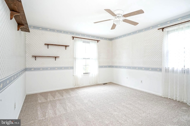 612 Howard Ave, Pitman, NJ 08071 - carpeted empty room featuring a ceiling fan, wallpapered walls, and baseboards