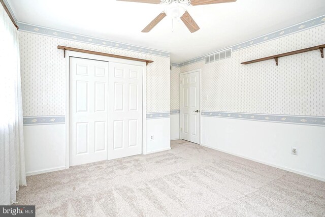 612 Howard Ave, Pitman, NJ 08071 - unfurnished bedroom with wallpapered walls, carpet flooring, a closet, and a ceiling fan