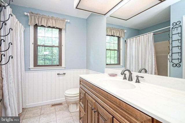 612 Howard Ave, Pitman, NJ 08071 - bathroom featuring wainscoting, tile patterned flooring, toilet, vanity, and a shower with shower curtain