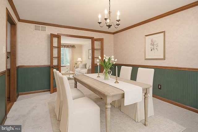 612 Howard Ave, Pitman, NJ 08071 - dining room featuring wainscoting, a chandelier, light colored carpet, and ornamental molding