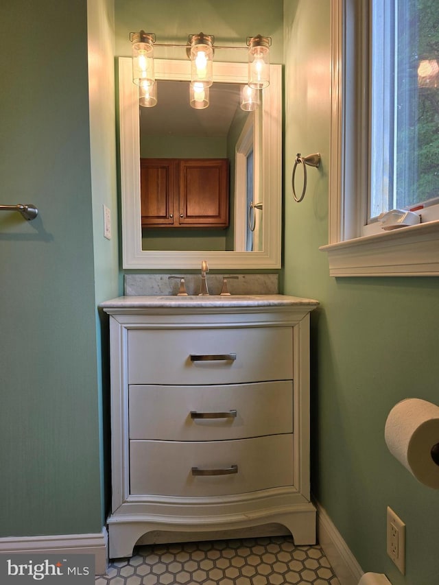5934 Tilghman Island Rd, Tilghman, MD 21671 - bathroom featuring vanity, baseboards, and tile patterned floors