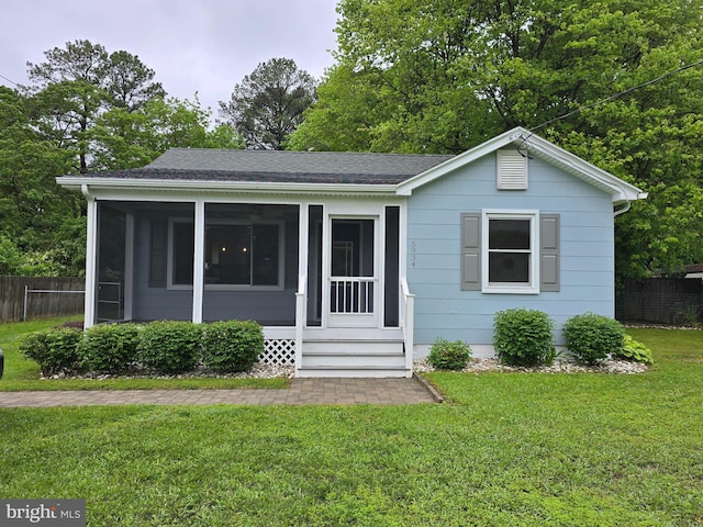 5934 Tilghman Island Rd, Tilghman, MD 21671 - view of front facade featuring a sunroom and roof with shingles
