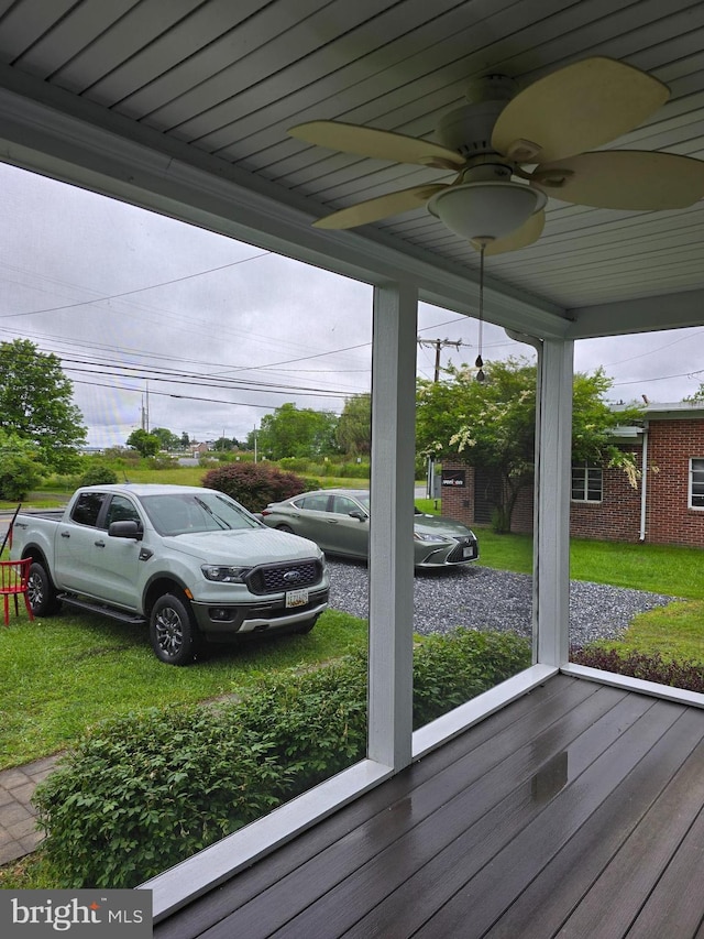 5934 Tilghman Island Rd, Tilghman, MD 21671 - wooden deck with a ceiling fan and a lawn