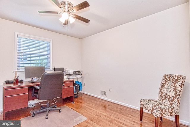 office with wood finished floors, ceiling fan, and baseboards