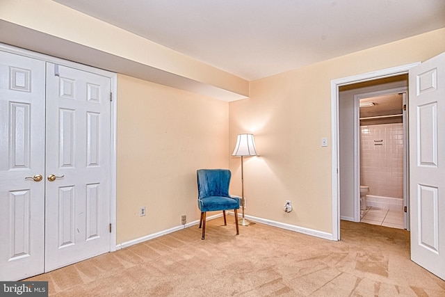 unfurnished room with light carpet and baseboards