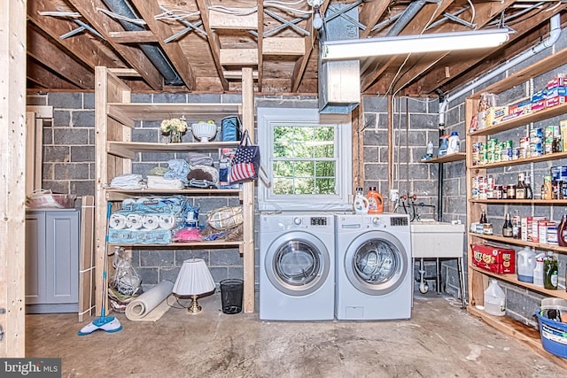 laundry area with independent washer and dryer