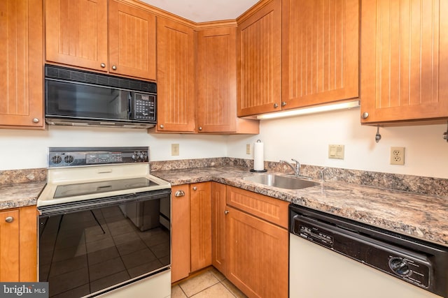 105 120th St Unit 87, Ocean City, MD 21842 - kitchen featuring black microwave, white dishwasher, electric range, light tile patterned floors, and a sink