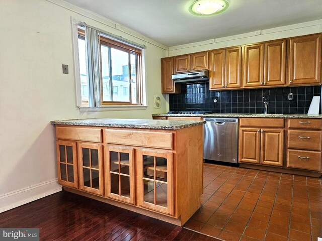 1506 N 13th St, Philadelphia, PA 19122 - kitchen with stainless steel dishwasher, a sink, tasteful backsplash, brown cabinets, and glass insert cabinets