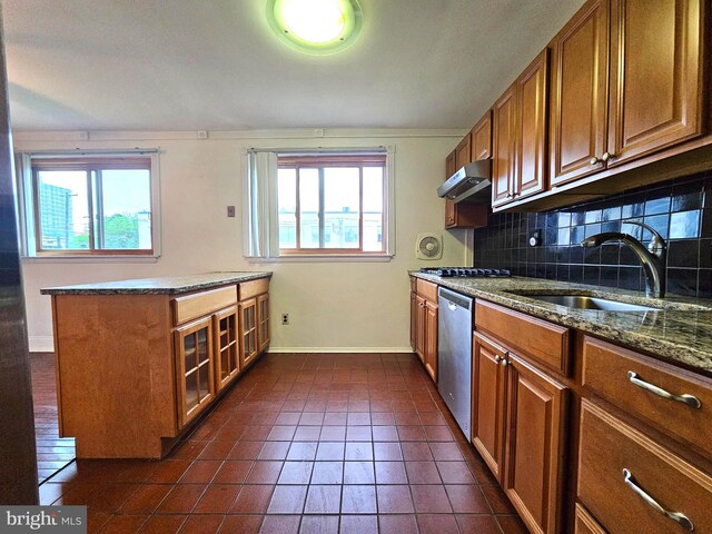 1506 N 13th St, Philadelphia, PA 19122 - kitchen with stainless steel appliances, a sink, brown cabinetry, and baseboards