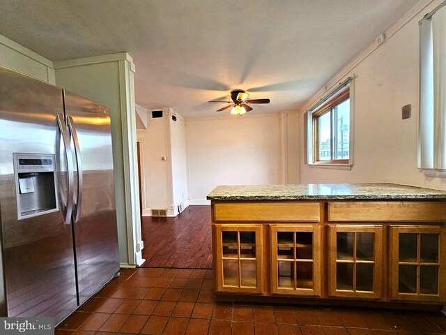 1506 N 13th St, Philadelphia, PA 19122 - kitchen featuring stainless steel fridge, dark tile patterned floors, a ceiling fan, brown cabinets, and glass insert cabinets